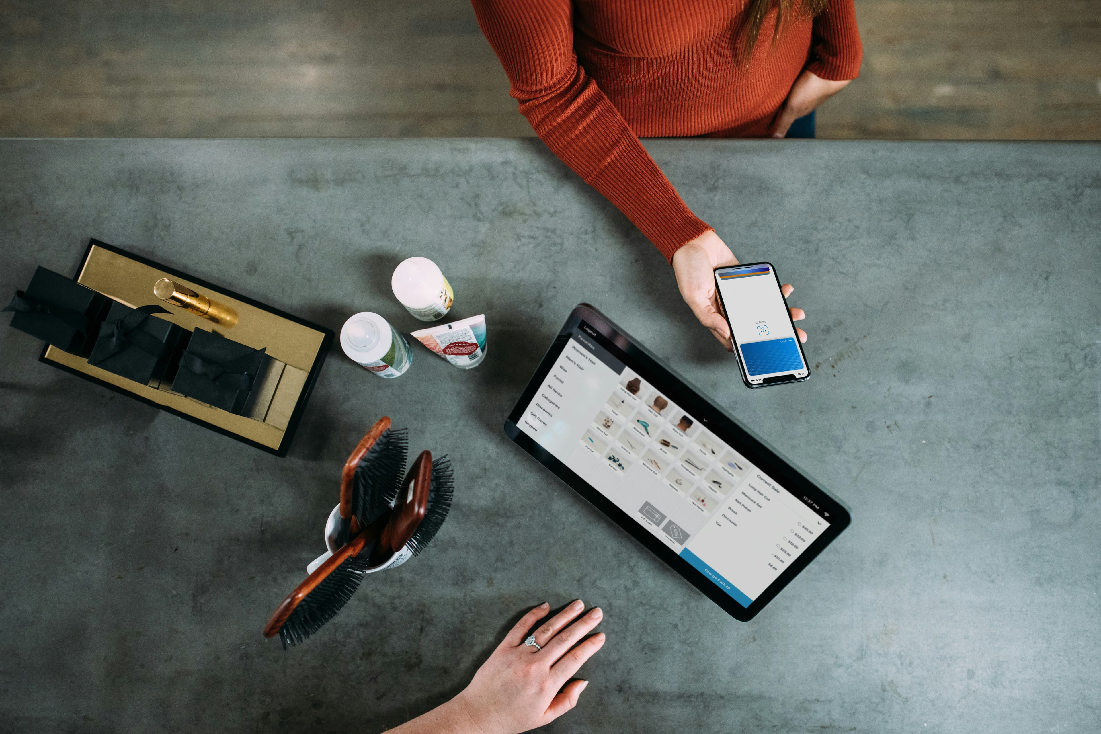 person holding smartphone beside tablet computer - Photo by Blake Wisz on Unsplash